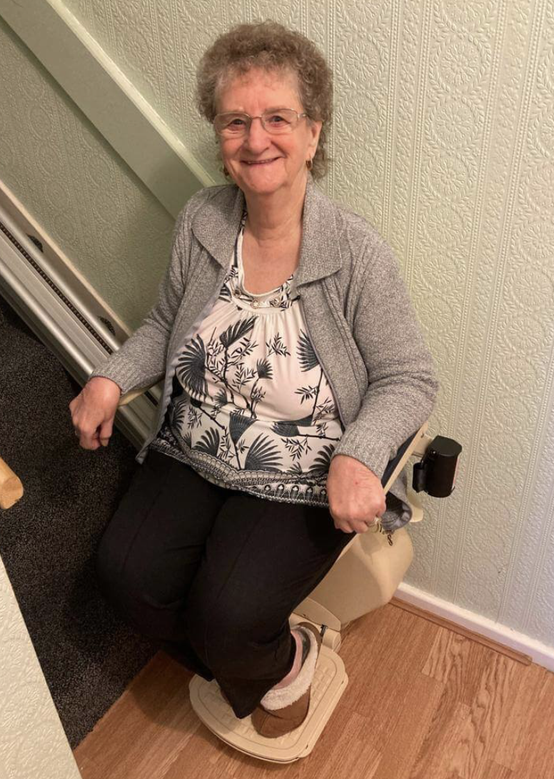Mrs Higgins with her new Brooks stairlift in Stafford
