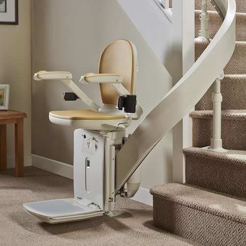 Curved stairlift fitted to a custom-made curved rail